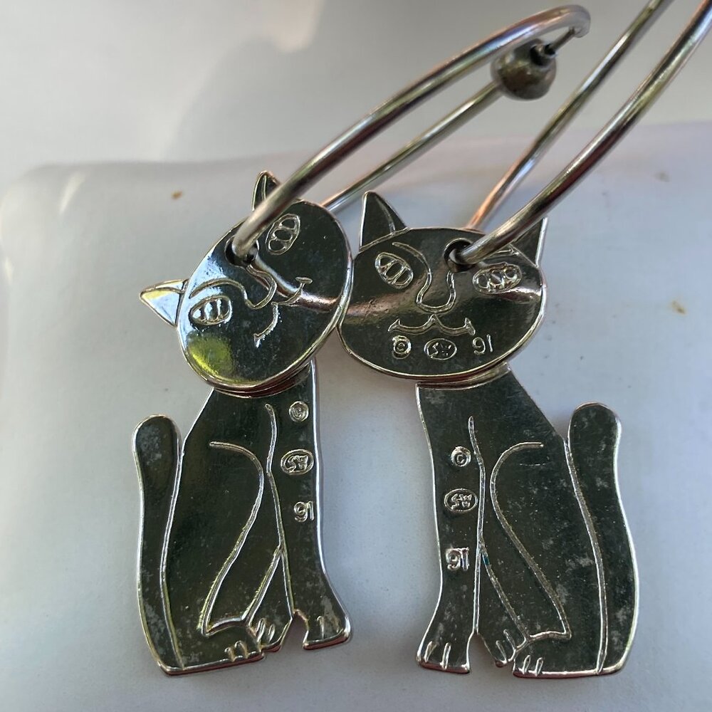 SW silver tone two-part cat earrings on hoop
